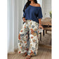 Tweedelige set voor dames: top met blote schouders en broek met print